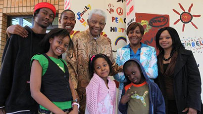 Zoleka (top right) and daughter, Zenani (bottom left) back in August 2009 when her grandfather, Nelson (top centre) was still alive