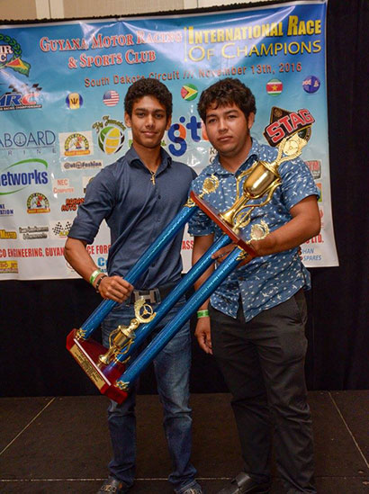 Displaying his trophies, Matthew stands with Steven Nobrega, who was part of his team for the 2016 season
