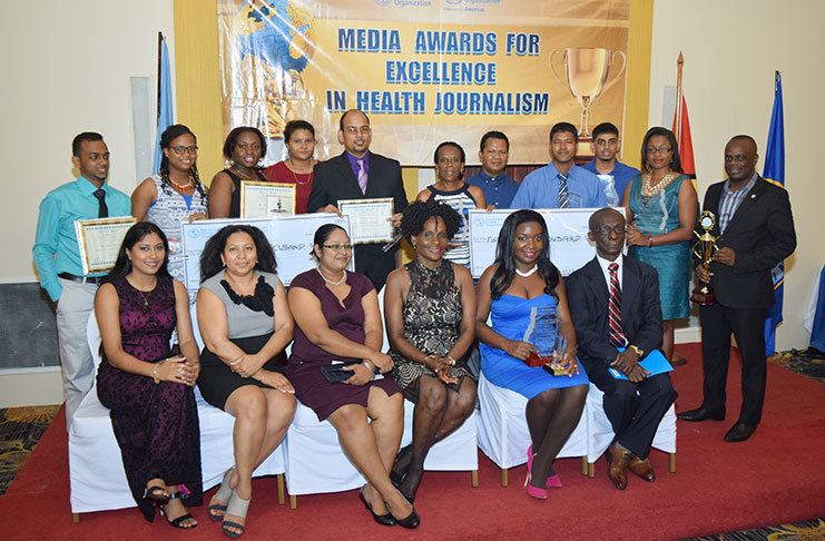 Overall winner of the 2016 PAHO/WHO health awards Chronicle’s Svetlana Marshall (second right), PAHO/WHO Country Representative, Dr William Adu-Krow (right), Chief Judge of the awards, Dr Paloma Mohamed and the other judges of the awards with the 2016 awardees