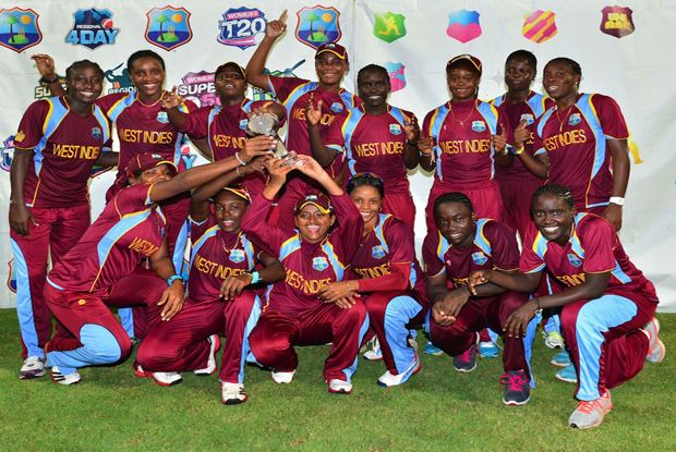 West Indies players pose with the trophy after beatin England in the Tri-Nation Series final on Saturday night at Kensington Oval.