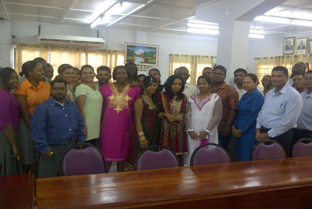 The staff of the Local Government Ministry decked out in their Indian wear pose for a photo