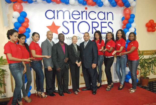 Models signifying the gifts American Stores are bringing to Guyana