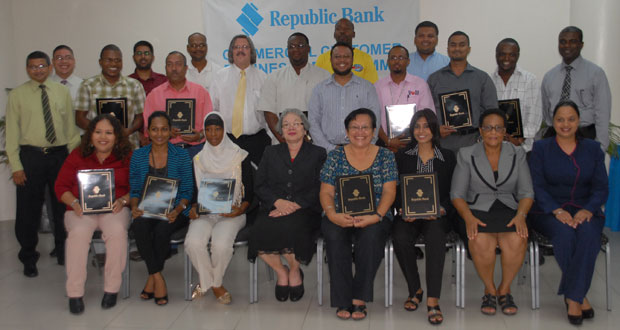 Participants of the Business Programme are surrounded by staff of Republic Bank (Photo by Sonell Nelson)