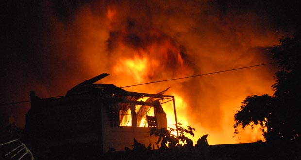 The last of Comfort Sleep: The building which housed the administrative and other departments of Comfort Sleep being devoured as the fire razes through.