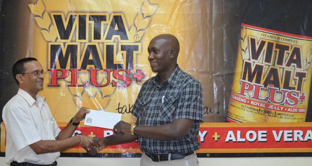 Banks DIH’s Non-Alcoholic Brand Manager, Clayton Mc Kenzie (right), proudly hands over his Company’s sponsorship to a smiling GCF president, Shiv Nandalall.