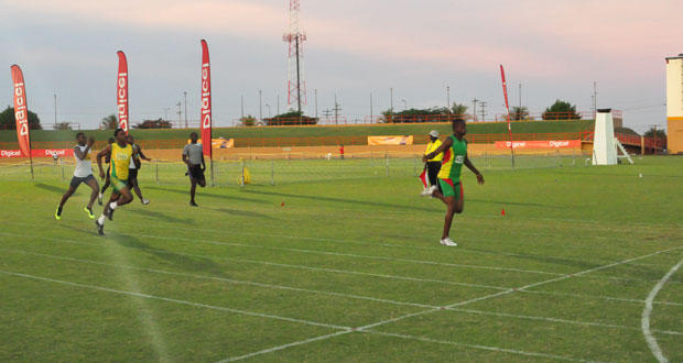 District 4 athlete Jason Yaw is all alone as he break’s the under-18 Boys 200-metre record set by Samuel Doris last year (Photo by Sonell Nelson).
