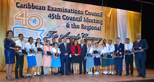Minister of Education, Hon. Priya Manickchand with C.X.C officials and awardees last evening at the National Cultural Centre (Cullen Bess-Nelson photo)