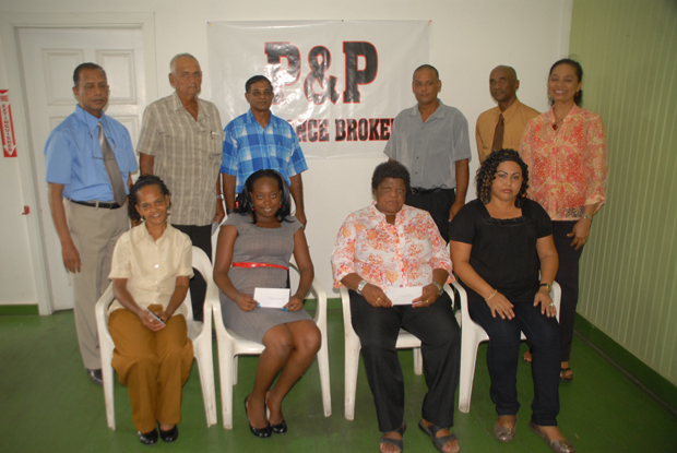 Proud donors of $1M to charity, Managing Director of P&P, Mr. Bish Panday (standing at left) and Mrs. Ahilia Panday (standing at extreme right), pose with representatives of the recipient organisations.