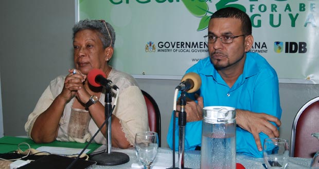 Facilitator Ms. Joycelyn Dow and Minister Robert Persaud at the head table