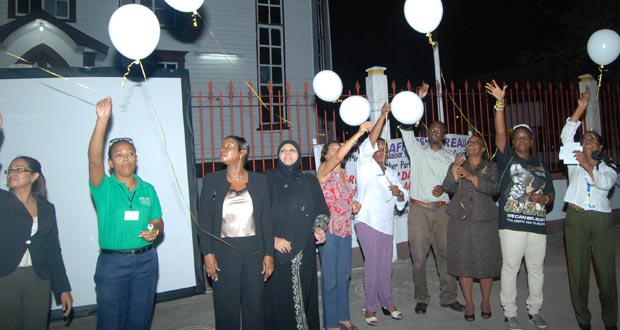 First Lady Deolatchmee Ramotar, Minister Jennifer Webster and others release their balloons. (Photo by Cullen Bess Nelson)