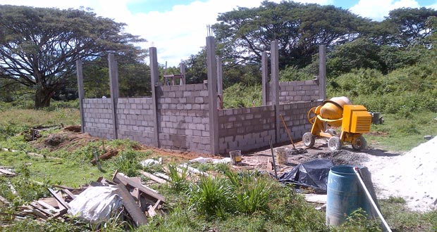 An incomplete generator house with workers still working can be seen here, even as the completion deadline has passed.