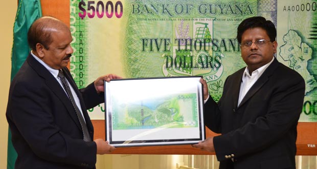 Finance Minister Dr Ashni Singh and Deputy Governor of Bank of Guyana Dr Gobin Ganga during the recent unveiling of the new $5000 currency note.