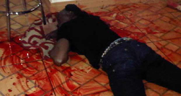 The intruder lying on the floor after he was shot by one of the occupants of the house