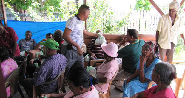 Member of Parliament Faizal Jaffarally & PPP/C activists distributing meals in Canefield, East Canje, Berbice