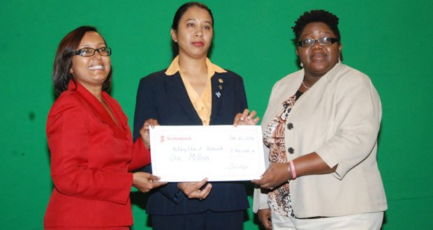 Jennifer Cipriani of Scotiabank hands over a cheque to President of the Rotary Club of Stabroek, Sharon Sue-Hang; looking on is Secretary, Grace McAlman.