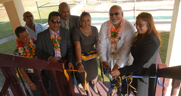 President Donald Ramotar cuts the ceremonial ribbon to re-commission the Leonora Magistrate’s Court. Also in photo are Chief Magistrate Priya Sewnarine-Beharry (right),  Minister Anil Nandlall, Justice Carl Singh, Region Three Chairman Julius Faerber, and Clerk of Court of the West Demerara Magisterial District Ms Haimwantie Singh (third from right).