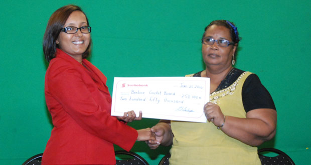 Marketing Manager of Scotiabank Jennifer Cipriani (left) beams as she proudly hands over the cheque to secretary of the BCB, Angela Haniff. (Photo by Cullen Bess-Nelson)