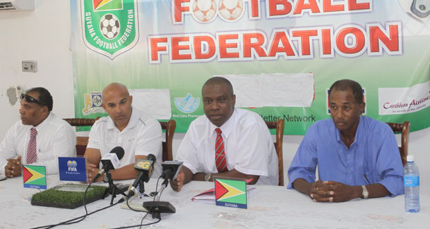 Guyana Football Federation president Christopher Matthias (second right) addressing members of the media yesterday at the Federation’s headquarters. Others in this Sonell Nelson photo are, from left; Ivan Persaud, Mark Rodrigues (Technical Director GFF) and Keith Ojeer.