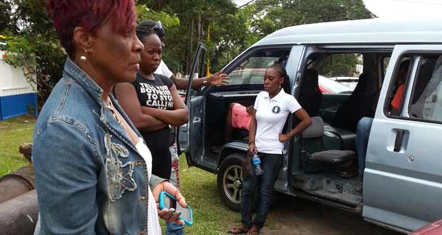 June Seaforth with wife of the deceased, Aboila Mc Pherson yesterday.