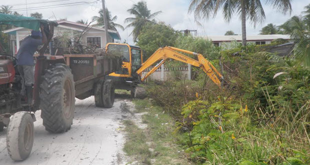 One of the mini excavator desilting a drain in the Town of Anna Regina