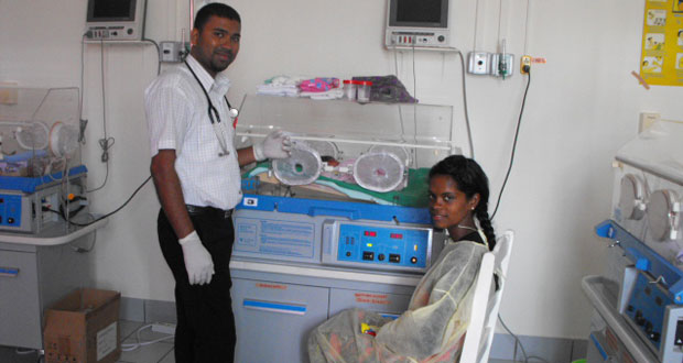 Dr Narendra Singh along with mother Sherry Hack and little Travis Lashley (in incubator) at the Neonatal Intensive Care Unit (NICU) in New Amsterdam