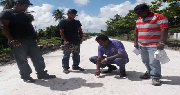 Region 2 Chairman Mr Parmanand Persaud inspecting a road under construction