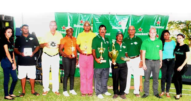Mike Mangal (fifth from left) is in company with the other top finishers and organisers of yesterday’s Heineken Cup Golf tournament.