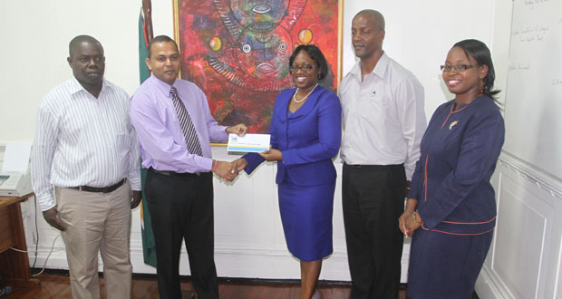 From left, Mr. Andrew Tyndall, Minister Frank Anthony, Ms. Michelle Johnson, Mr. Alfred King and a representative of Republic Bank