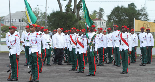 President Ramotar inspecting the Guard of Honour on the Drill Square at Base Camp Ayanganna yesterday afternoon before delivering the feature address (Photos by Sonell Nelson)