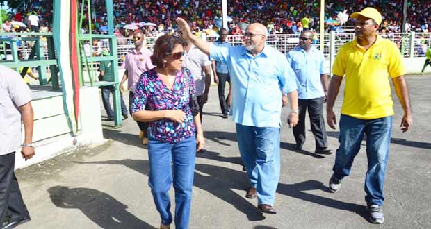 resident Donald Ramotar and First Lady Deolatchmee Ramotar entering the National Park Sunday to witness the judging of the Costume and Float Parade. With them (at right) is Minister of Culture, Youth and Sport, Dr. Frank Anthony