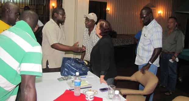 Presidential Advisor on Governance Ms. Gail Teixeira interacting with a Linden resident after wrapping up the town hall meeting on Wednesday last.