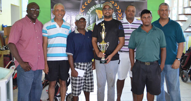 George Bulkan (with trophy) and members of the successful Underdogs team pose with Banks DIH Sales and Marketing Executive Carlton Joao and Citizens Bank Senior Credit and Marketing Manager Lindel Harlequin.