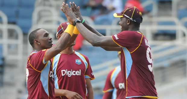 Man-of-the-Match  Dawyne Bravo is being congratulated by Jason Holder after collecting one of his three wickets. (Windiescricket photos)