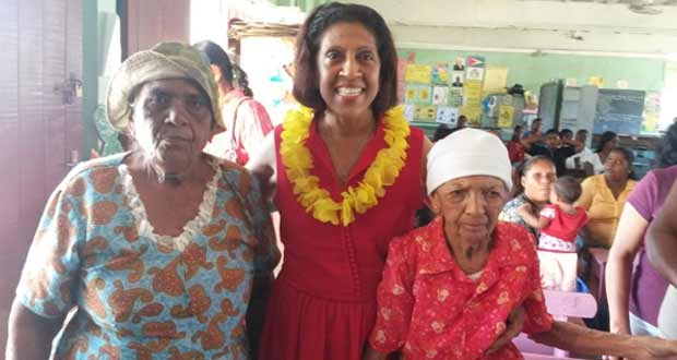 First Lady Deolatchmee Ramotar with two senior citizens at the Zeelugt Primary School