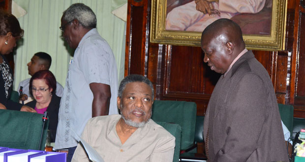 Prime Minister Samuel Hinds and Clerk of the National Assembly, Sherlock Isaacs, in a brief exchange prior to yesterday’s start of the 2014 Budget Debates