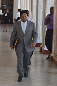 Finance Minister, Dr. Ashni Singh, makes his way to the Parliament Chamber, where he made his 2014 Budget presentation, three minutes shy of three hours, yesterday