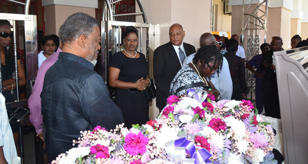 Prime Minister Samuel Hinds paying his last respects to Deborah Backer