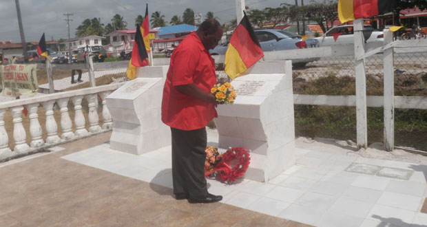 Parliamentarian Cornel Damon laying a wreath at the monument in memory of Dr. Jagan