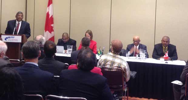 Dr. Nanda Gopaul, Minister of Labour, delivering his remarks at the Guyana Mining Day held at the Metro Toronto Convention Centre, Canada.   Seated from left are Mr. Bobby Gossai, Senior Policy Analyst, Ministry of Natural Resources and the Environment; Her Excellency, Dr. Nicole Giles, High Commissioner of Canada to Guyana; His Excellency, Harry Narine Nawbatt, High Commissioner of Guyana to Canada; and Mr. Rickford Vieira, Commissioner, Guyana Geology and Mines Commission (GGMC)