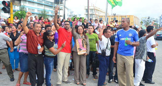 Amerindian residents from communities all across Guyana on the streets of Georgetown yesterday in protest of the opposition’s budgetary cuts. With them at centre is Minister of Amerindian Affairs, Ms Pauline Sukhai (Photo by Adrian Narine)