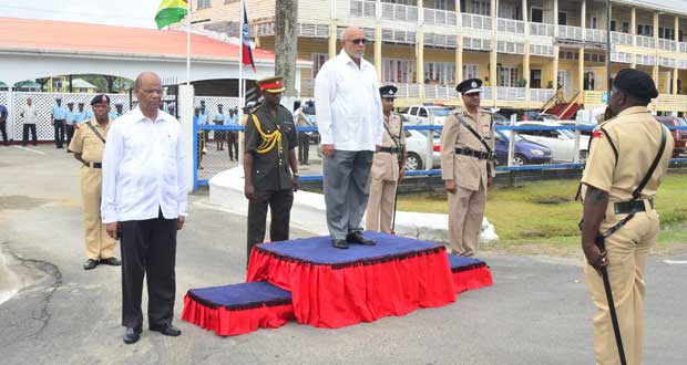 DUTY CALLS: President Donald Ramotar, as Commander-in-Chief of the Armed Forces, is about to inspect the Guard of Honour at the invitation of Superintendent Errol Watts of the Tactical Services Unit (TSU). With him (left and right of the dais respectively) are Home Affairs Minister, Mr Clement Rohee and Commissioner of Police (Ag,) Mr Seelal Persaud. The occasion was the opening yesterday of the Annual Police Officers’ Conference at Eve Leary(Photo by Adrian Narine)