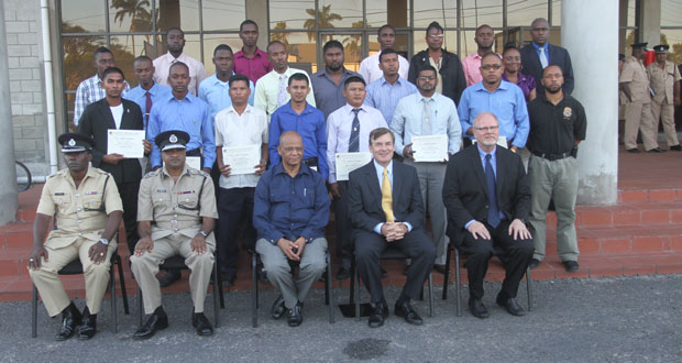 Home Affairs Minister Clement Rohee flanked by Police Commissioner Seelall Persaud, Force Training Officer Williams, US Ambassador D Brent Hardt, and US training officer Mr George Woessner