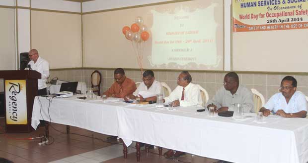 From left are Mr Patrick Findlay (speaking), Mr Charles Ogle, Labour Minister Dr Nanda Gopaul, Mr Samuel Goolsarran, Mr Dale Beresford and Mr Seepaul Narine