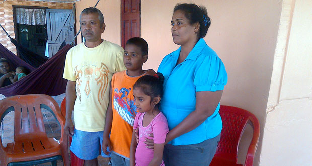 The dead couple’s children with the woman’s parents.