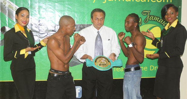 Here it is! GBBC/WBC/CABOFE president Peter Abdool (centre) proudly displays his organisation’s flyweight belt that will be defended by Guyana’s Dexter Marques (2nd left) against Jamaica’s Rudolph Hedge (2nd right). At extreme left and right respectively are Air Jamaica’s Alicia Abel and Chrystal Simmons.