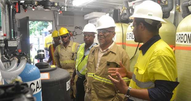 Prime Minister Samuel Hinds touring the operations Plant at Aurora Gold Mines