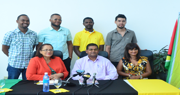 Fly Jamaica’s Roxanne Reece and GTA’s Indranauth Haralsingh (seated first and second left) with the five Guyanese ‘tourism ambassadors’(Photo by Adrian Narine)
