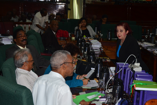 Government Chief Whip, Gail Teixiera, right, in talks with senior APNU MPs prior to the debate on a Motion to establish a Commission of Inquiry (COI) into allegations of torture by members of the Police Force (Photo by Adrian Narine)