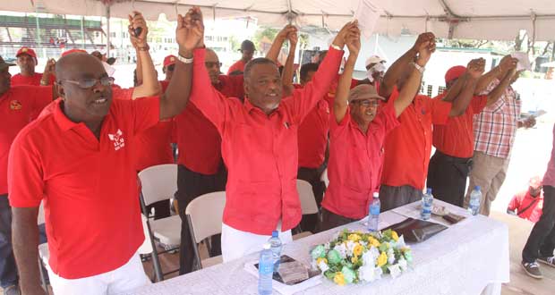 Acting President, Samuel Hinds, with other trade union leaders in a rendition of one of the union songs