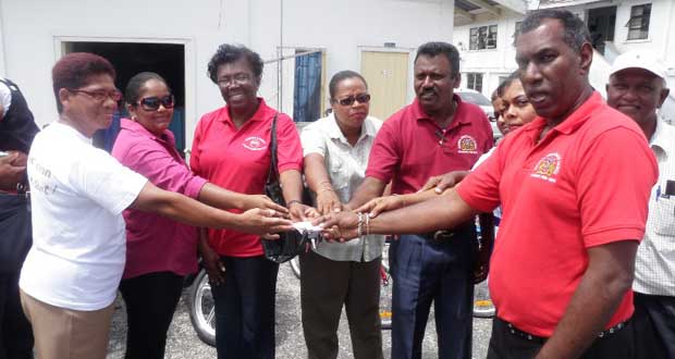 Region Two Chairman Parmanand Persaud, Regional Executive Officer Sunil Singh handing over the keys to the Environmental Department